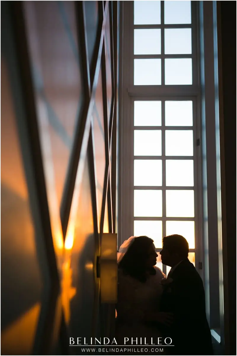 Bride and groom enjoy a romantic sunset at The Portofino Hotel, Redondo Beach, CA