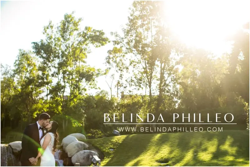 Bride and groom share a kiss on their wedding day at Coyote Hills Country Club, Fullerton, CA