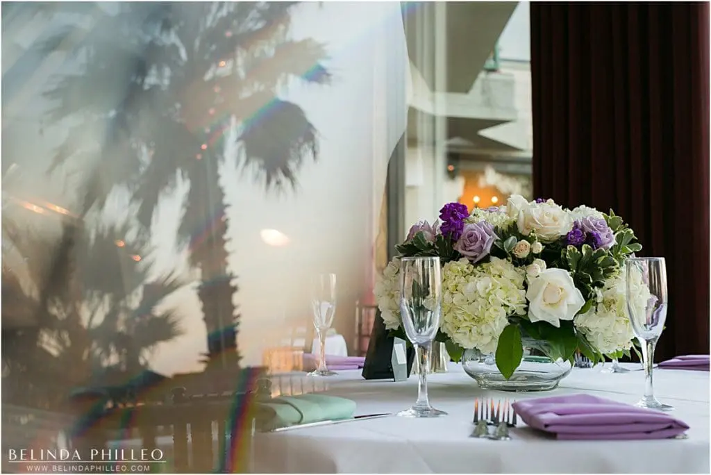 white and purple floral centerpieces at the Reef Restaurant, Long Beach, CA