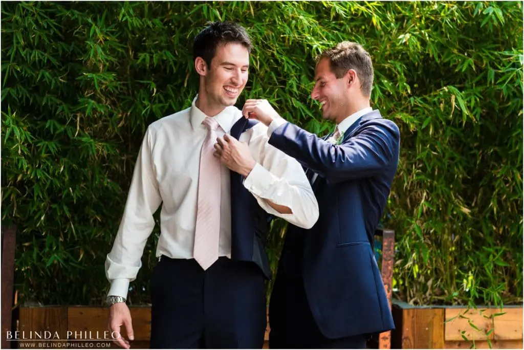 Best man helps groom get ready at Smog Shoppe Los Angeles. Photo by Belinda Philleo