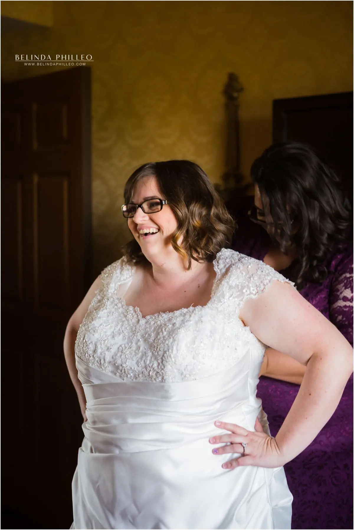 Bridesmaids help the bride get ready for her El Dorado Park Golf Course wedding