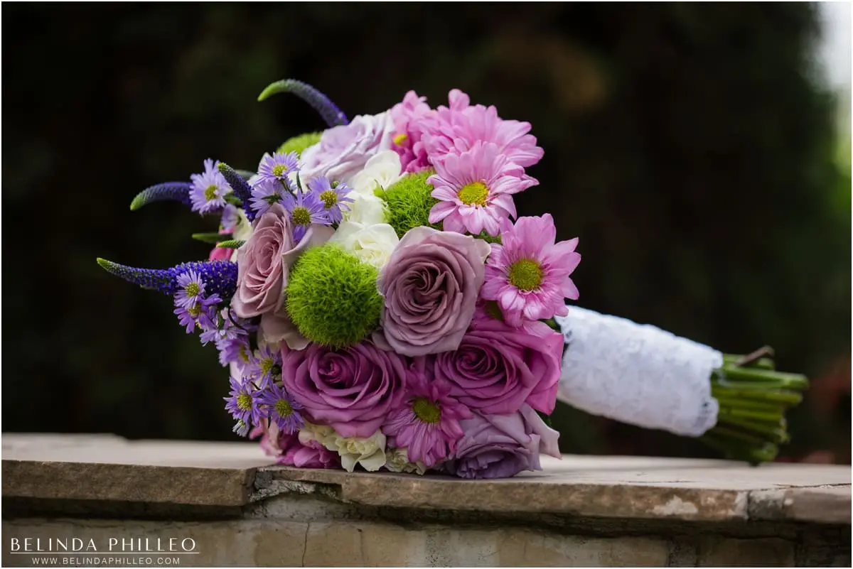 Purple bridal bouquet created by Kathy Santilli