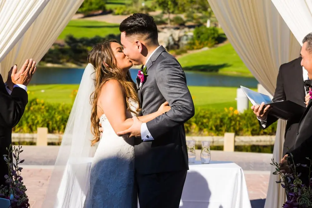 First kiss at Friendly Hills Country Club wedding ceremony