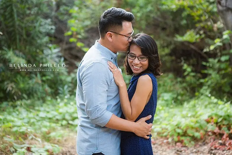 Engaged couples share an embrace at their Oak Canyon Nature Center engagement photos by Belinda Philleo