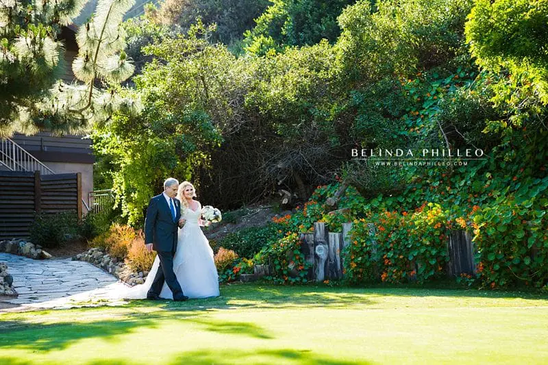 Bride is walked down the aisle at The Ranch at Laguna