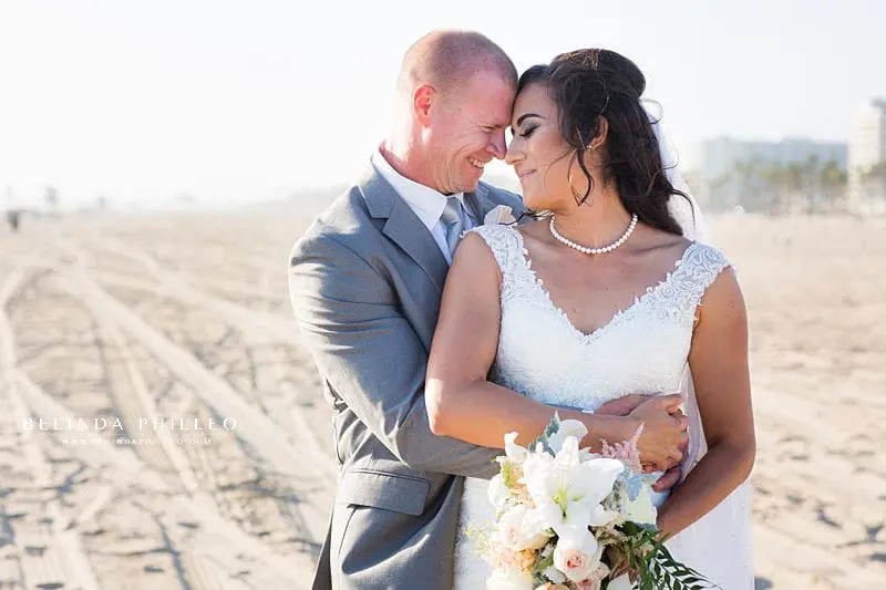 Bride and groom share a romantic moment after their Huntington Beach Wedding