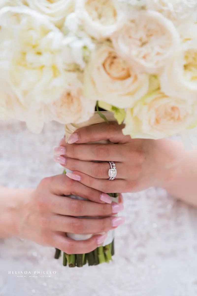 All white floral bridal bouquet by Petals & Linens