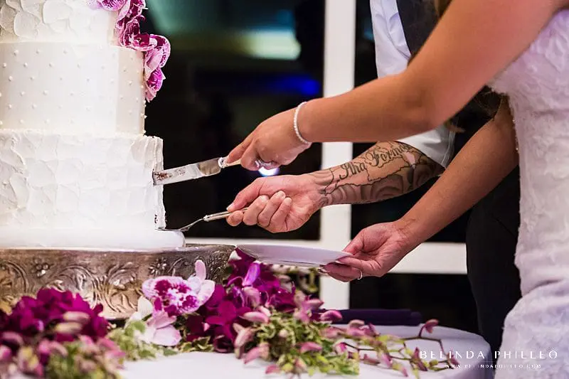 Bride and groom cut their cake from Simply Irresistible Cakes & Catering at their Friendly Hills Country Club wedding