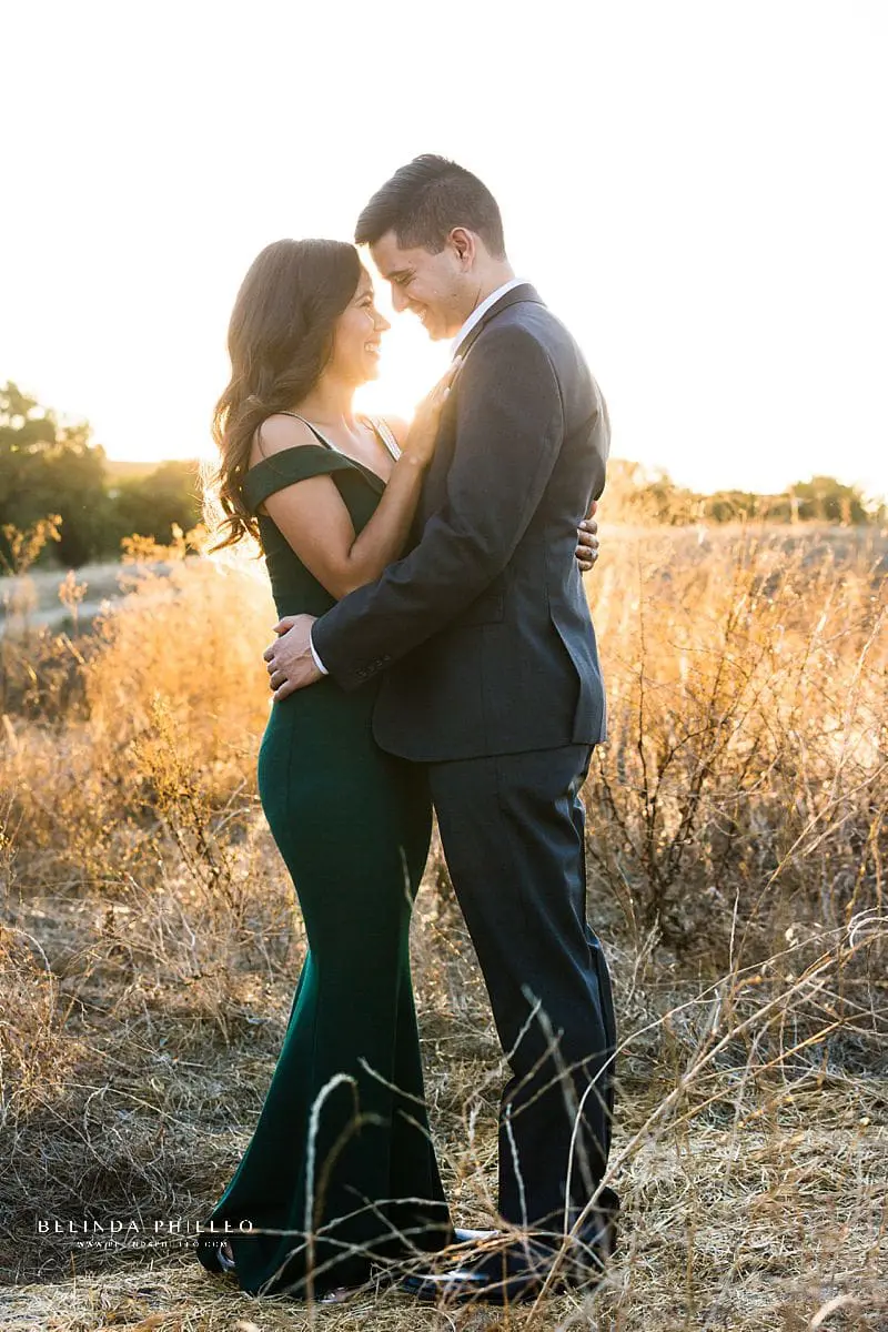 Bride-to-be and her fiance share a sweet moment during their Orange County engagement photo session with Photography by Belinda Philleo