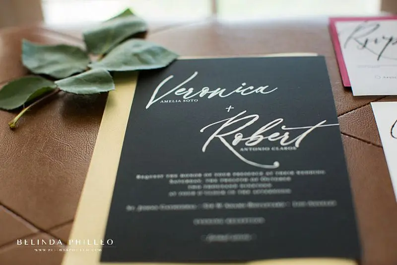 Black and gold wedding invitations made by Simply Stated Stationery