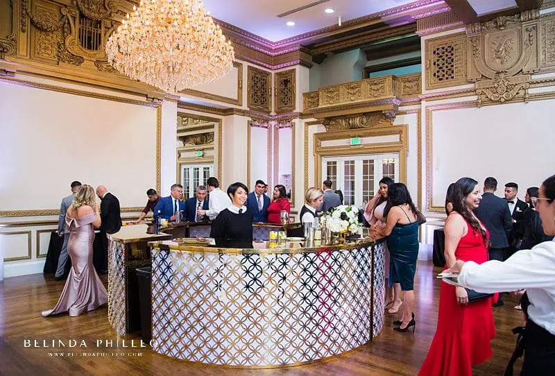 Ultra glamorous white and gold event bar at Alexandria Ballrooms wedding in Los Angeles, CA