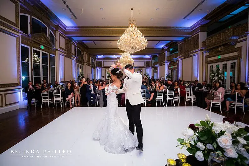 Bride and groom share their first dance during their wedding at Alexandria Ballrooms in Downtown LA. Photography by Belinda Philleo