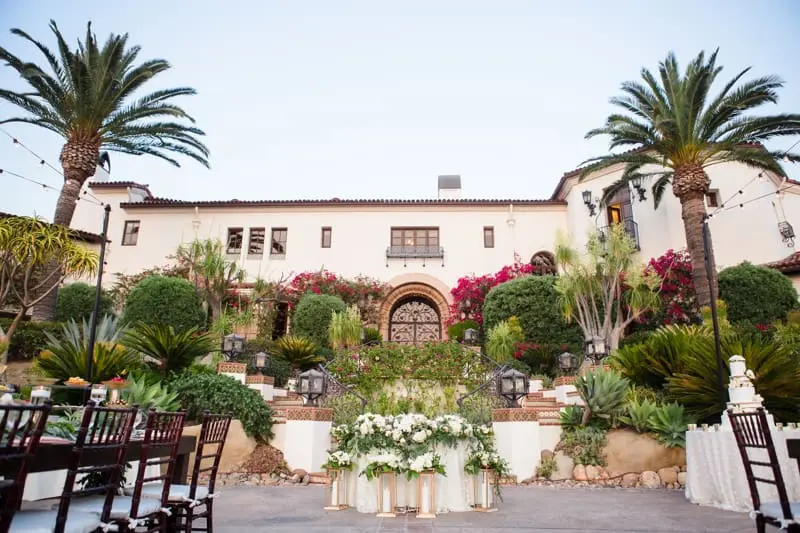 Outdoor wedding reception in front of the Villa at Hummingbird Nest Ranch