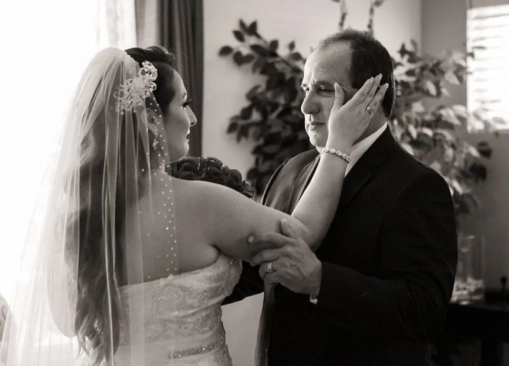 Bride wipes away her fathers tears