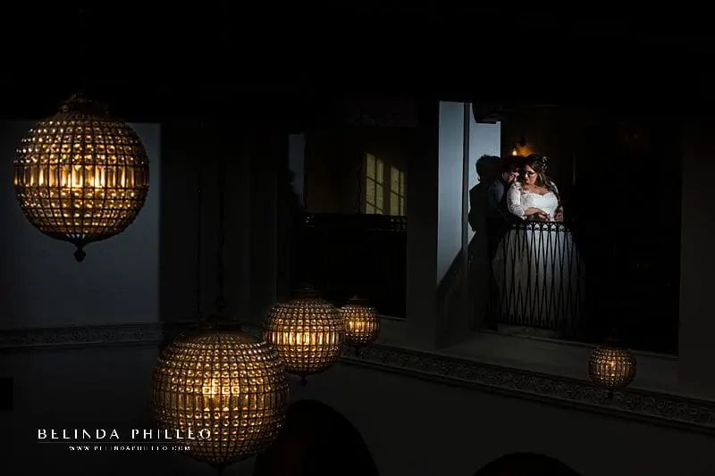 Dramatic image of newlyweds on the upper balcony of Ebell Club Long Beach