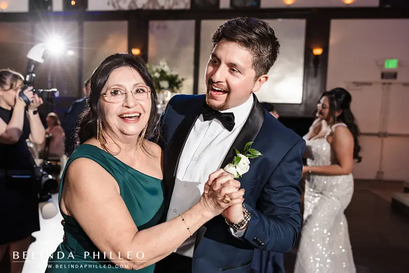 Groom dances with his mother at the reception