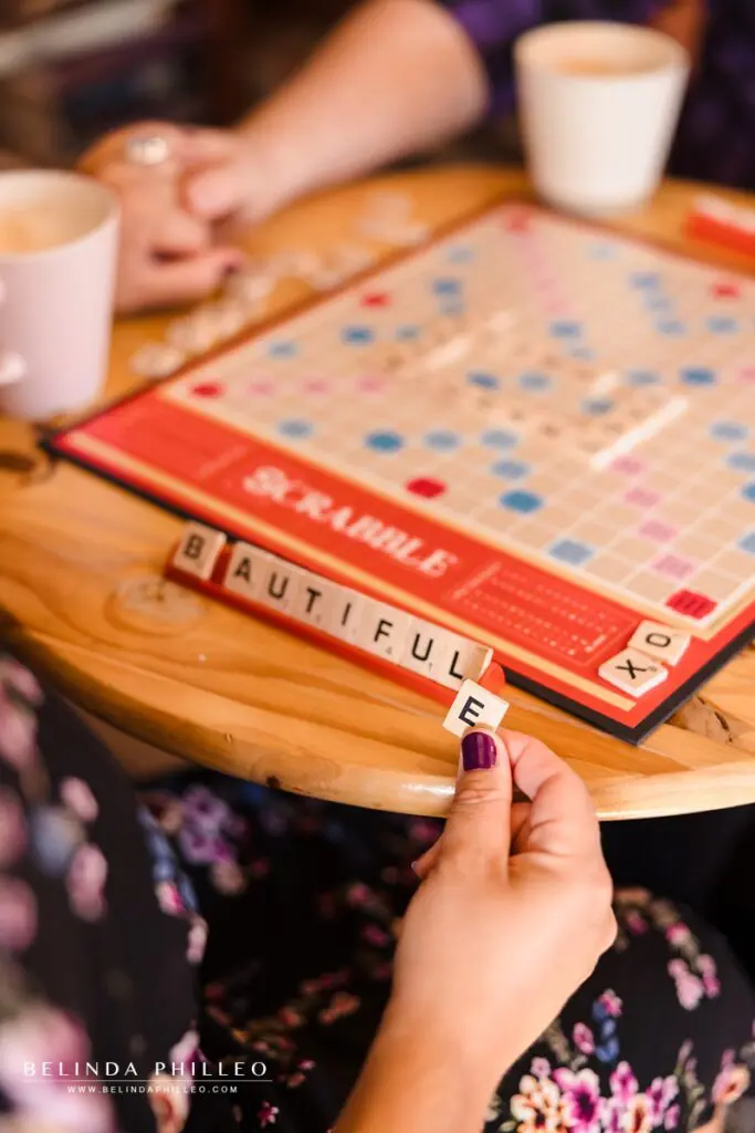 Closeup of a woman playing scrabble