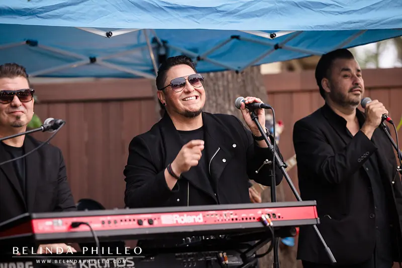 DW3 Band performs at a backyard wedding