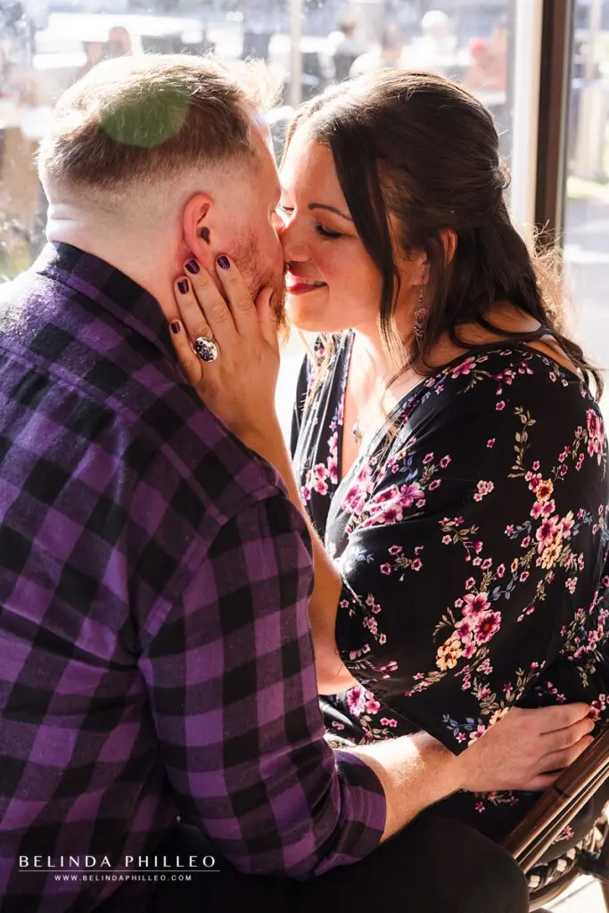 Woman pulls her fiance in for a kiss