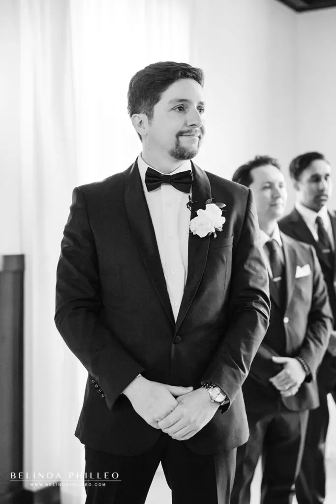 Groom watches, tearfully, as his bride walks down the aisle