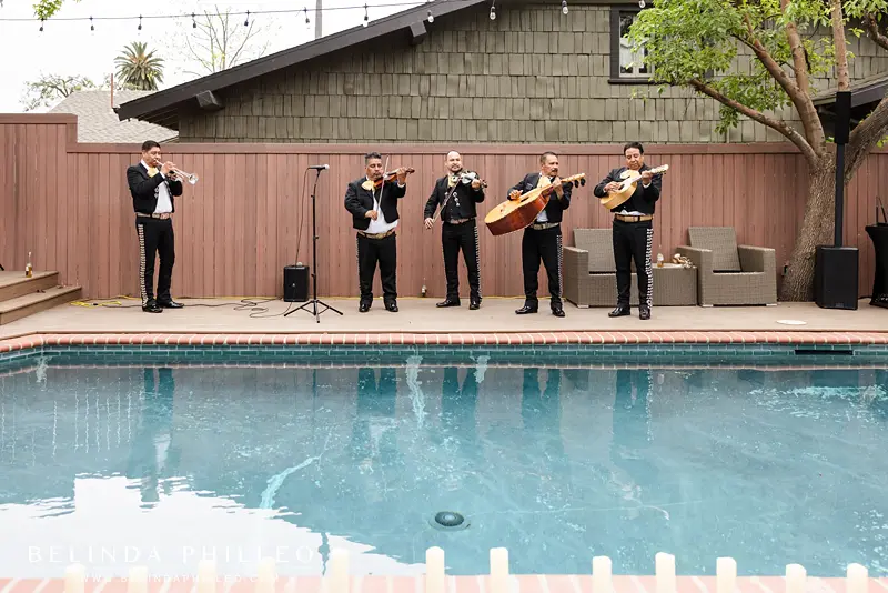 Mariachi band playing at a backyard reception