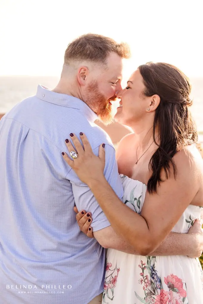 Couple about to kiss at sunset