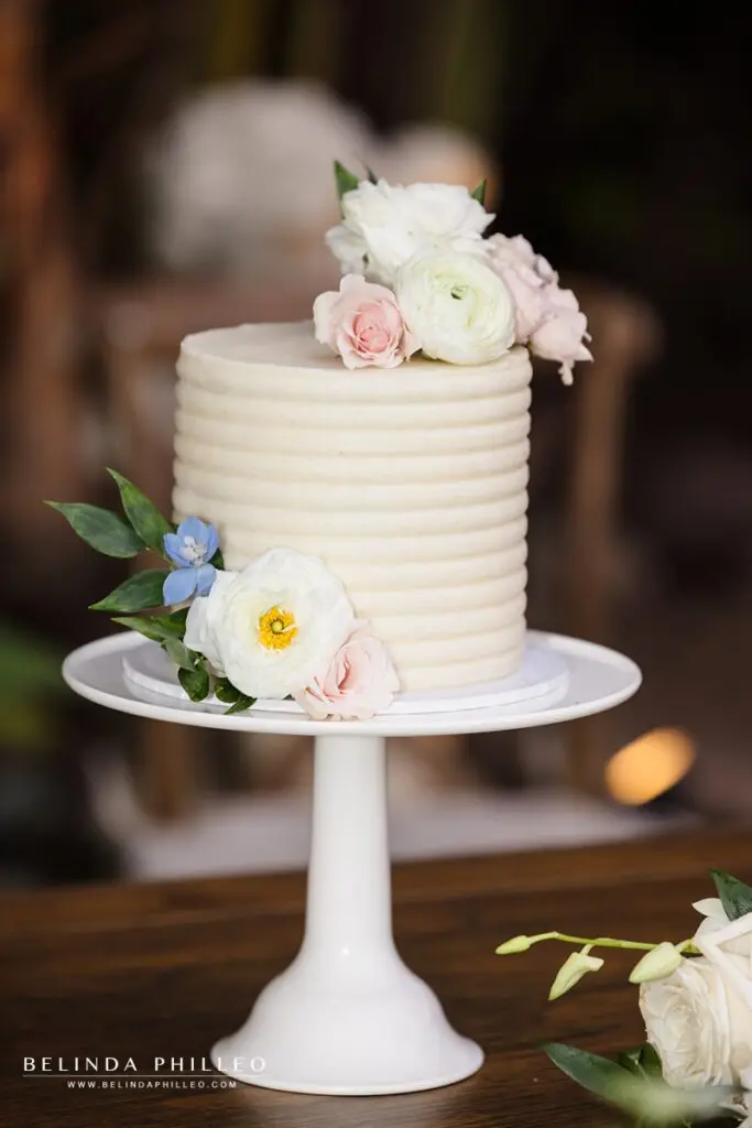 Small white cake decorated with flowers