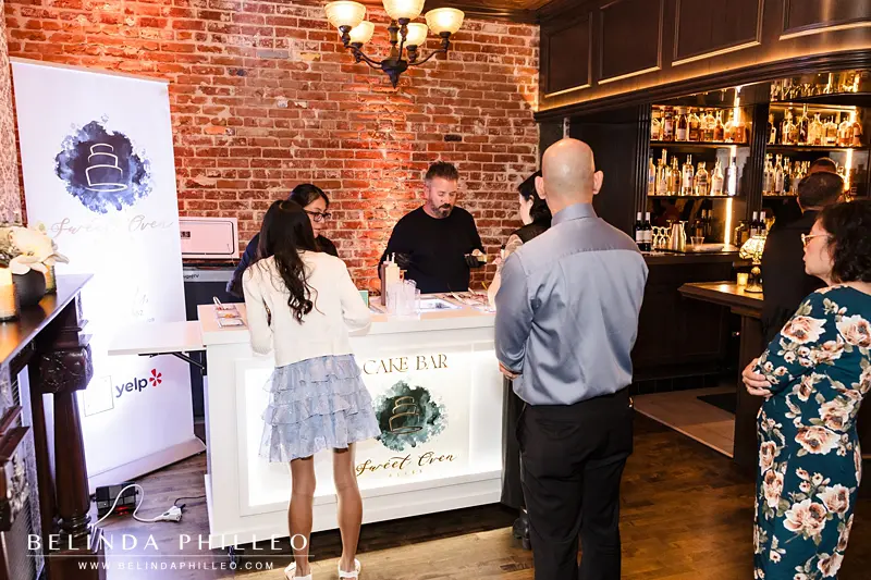 Sweet Oven Bliss serves cake to wedding guests
