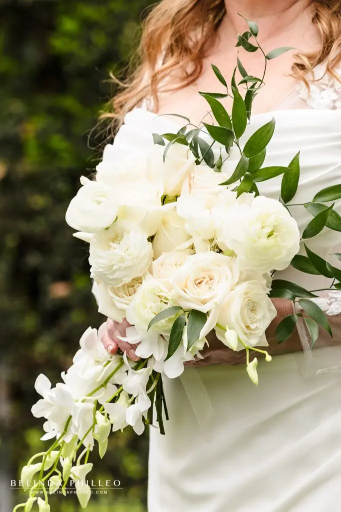 Closeup of white floral bridal bouquet with roses