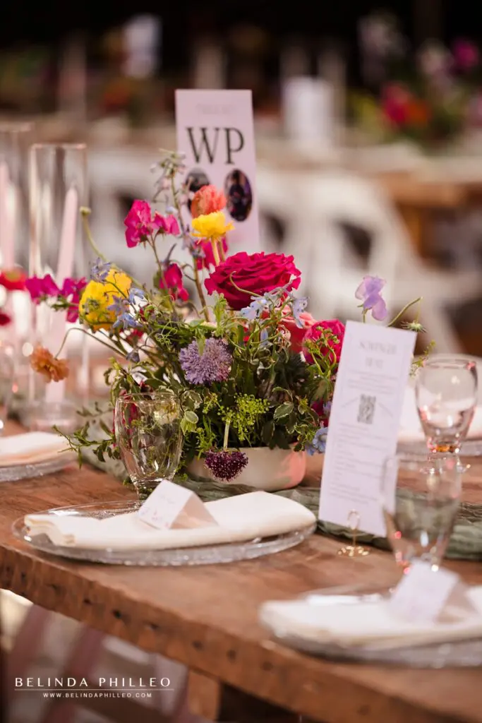 Colorful wildflower centerpieces created by Brass Fern House