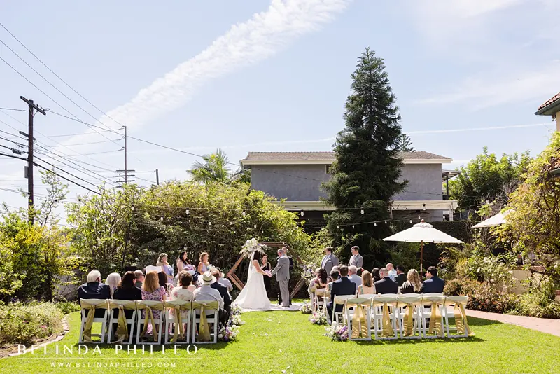 Wedding ceremony on the front lawn of The French Estate in Old Towne Orange, CA