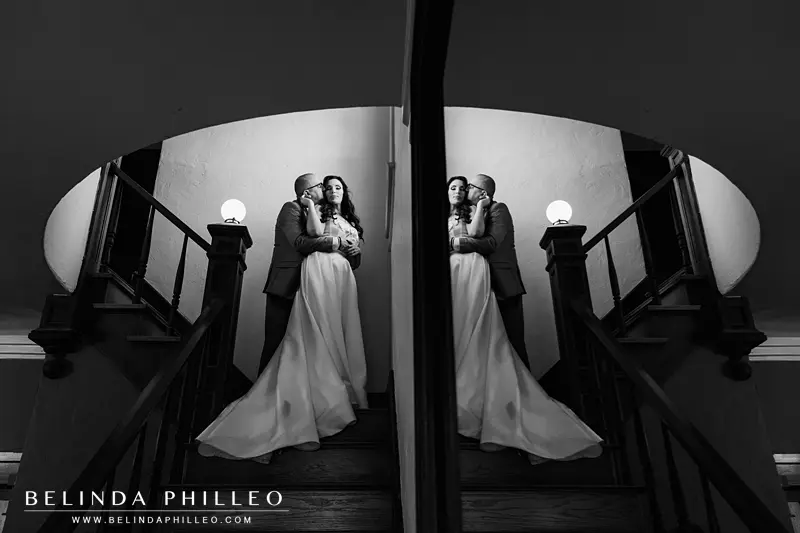 Creative image of a newlywed couple reflected in a mirror