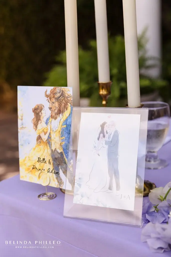 Disney-inspired watercolor art for wedding reception tables