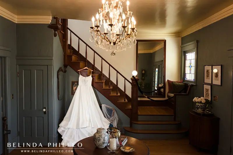Bridal gown hangs in foyer of The French Estate, Orange, CA