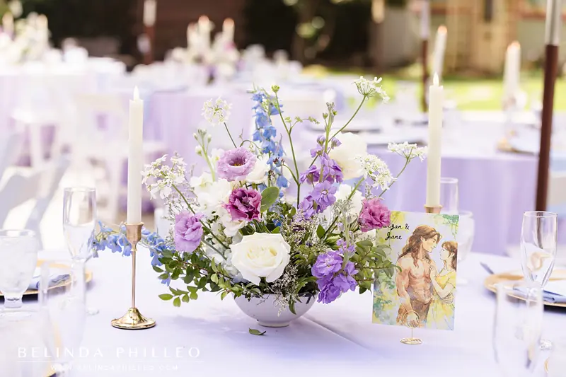 Disney-inspired watercolor portraits for wedding reception centerpieces