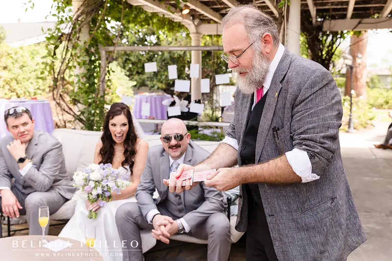 Magician entertains newlyweds during cocktail hour