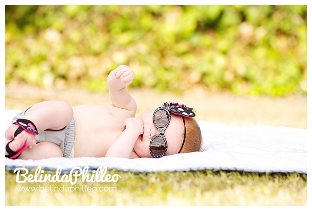 baby wearing sunglasses and headband