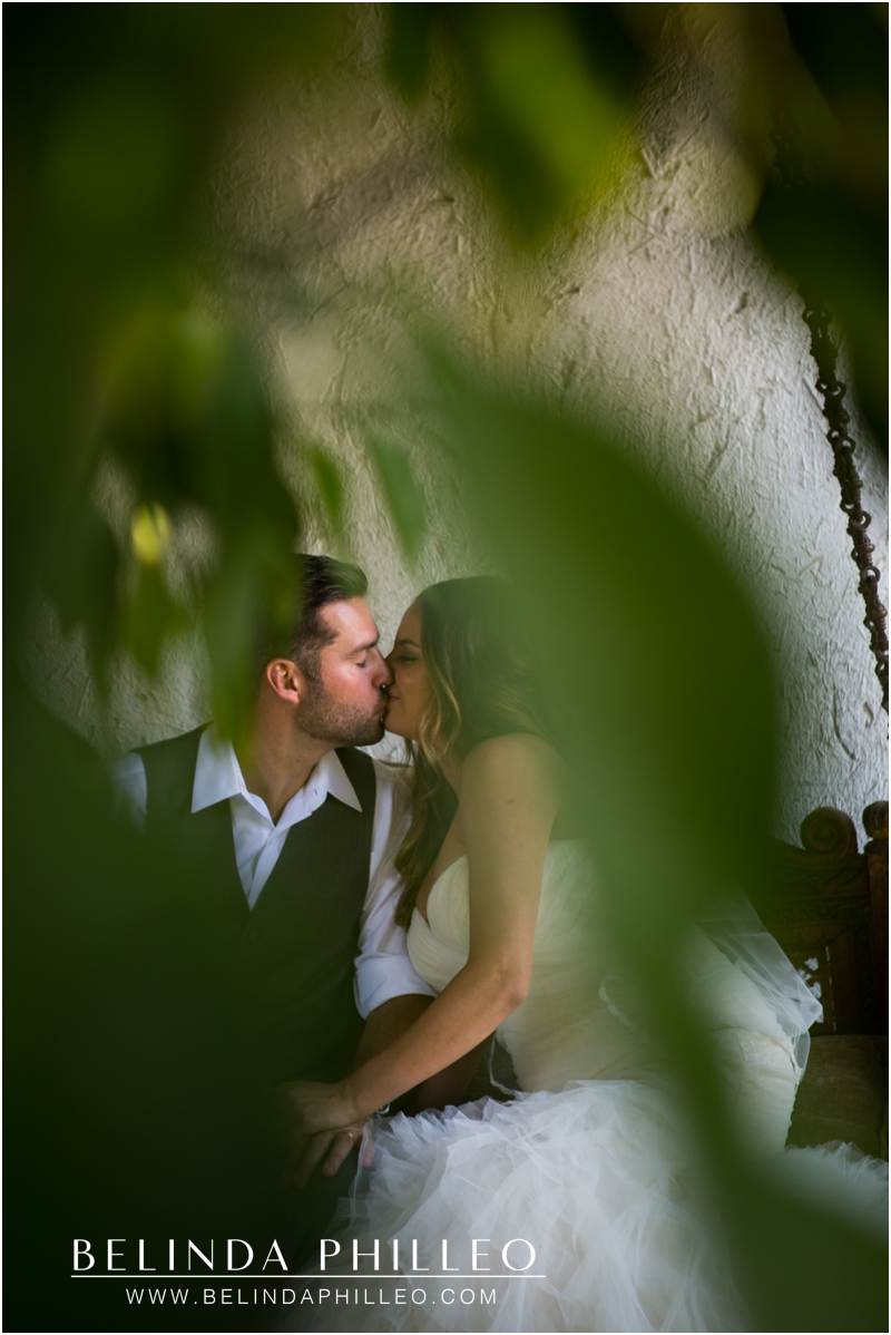 Bride and groom share a private kiss at their Casa Cody Inn Wedding in Palm Springs, CA