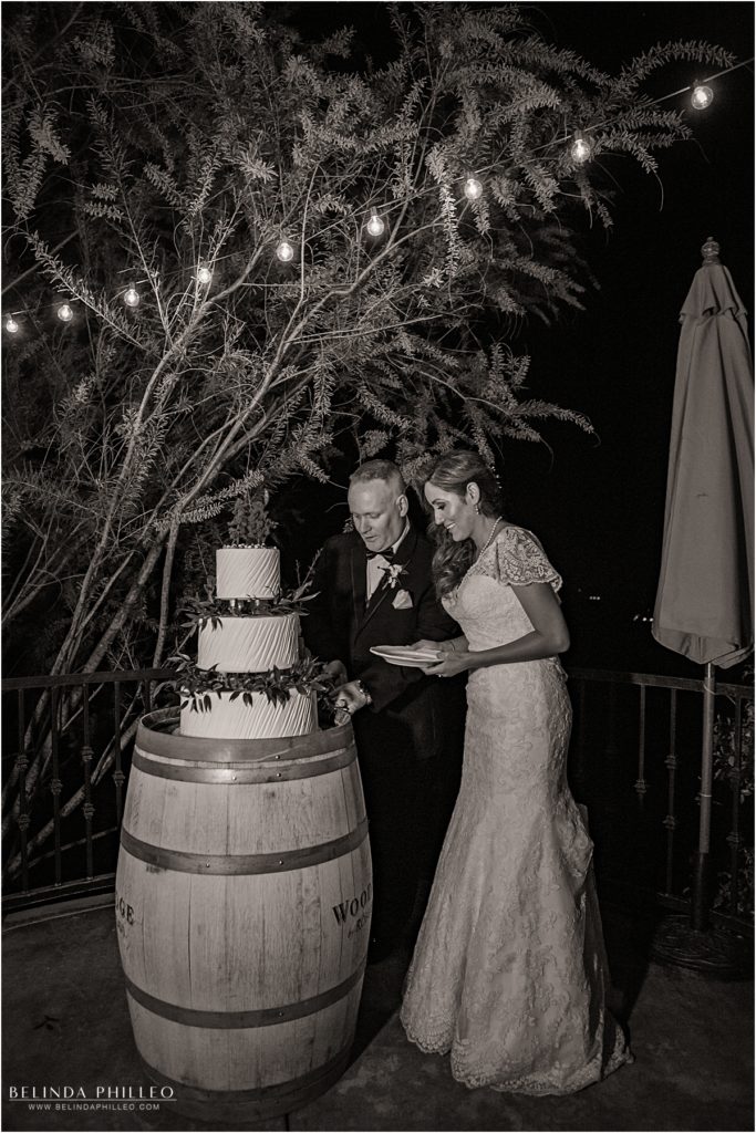 Newlyweds cut cake at their Serendipity Garden wedding reception in Oak Glen, CA