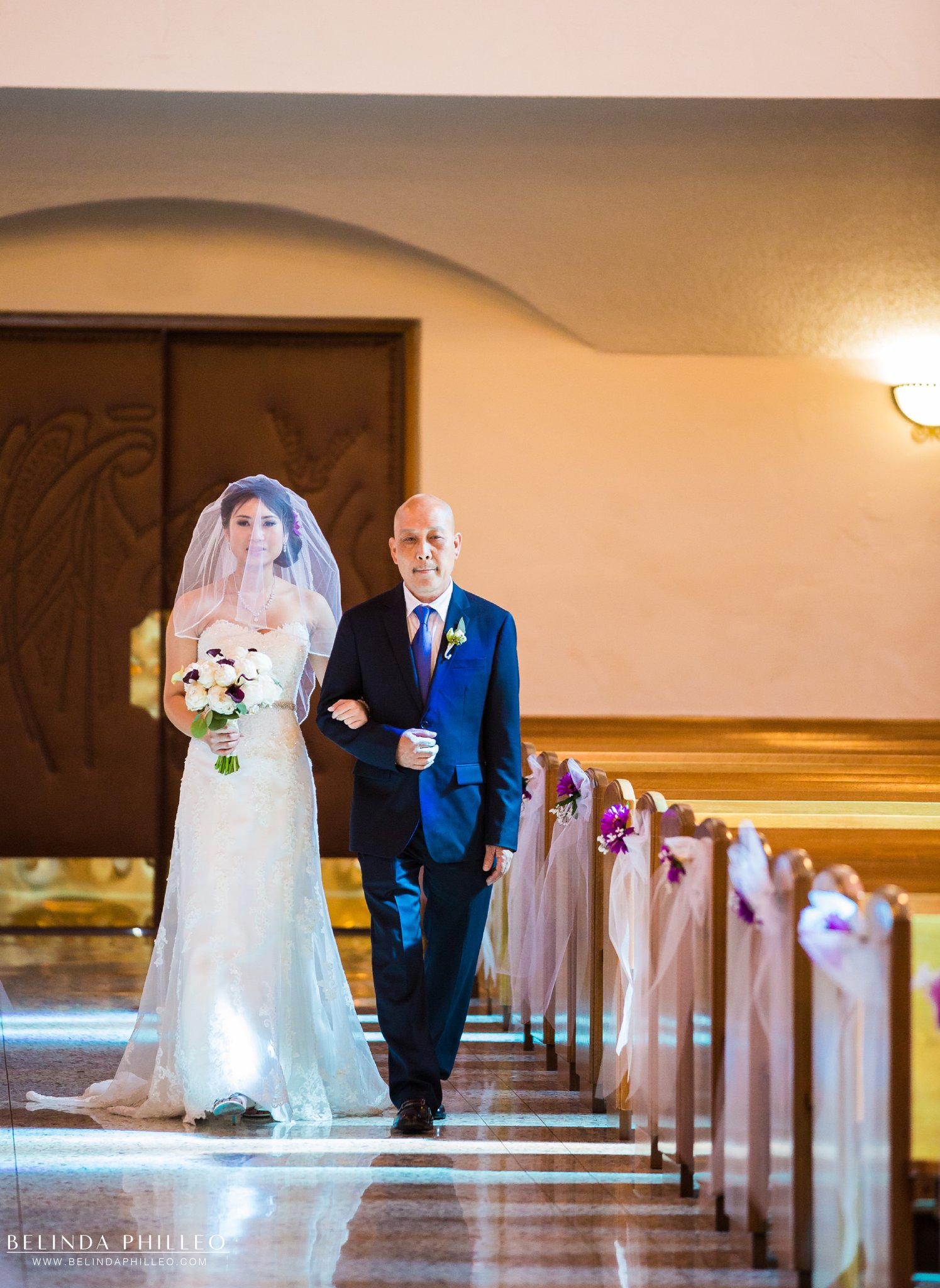 Bride is escorted down the aisle by her father at the San Gabriel Mission & church