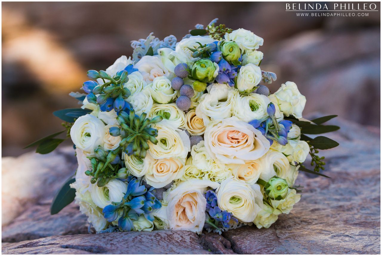 Blue and white bridal bouquet created by Flowers by Cina