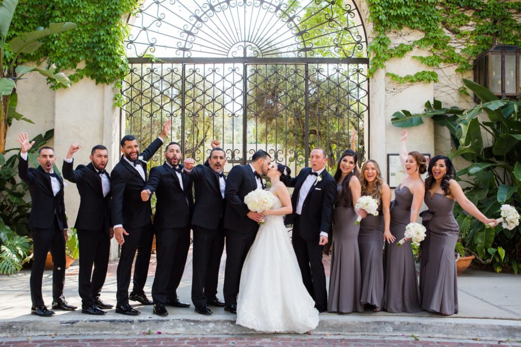 Bridal Party cheers for newlyweds at the entrance of Los Angeles River Center & Gardens