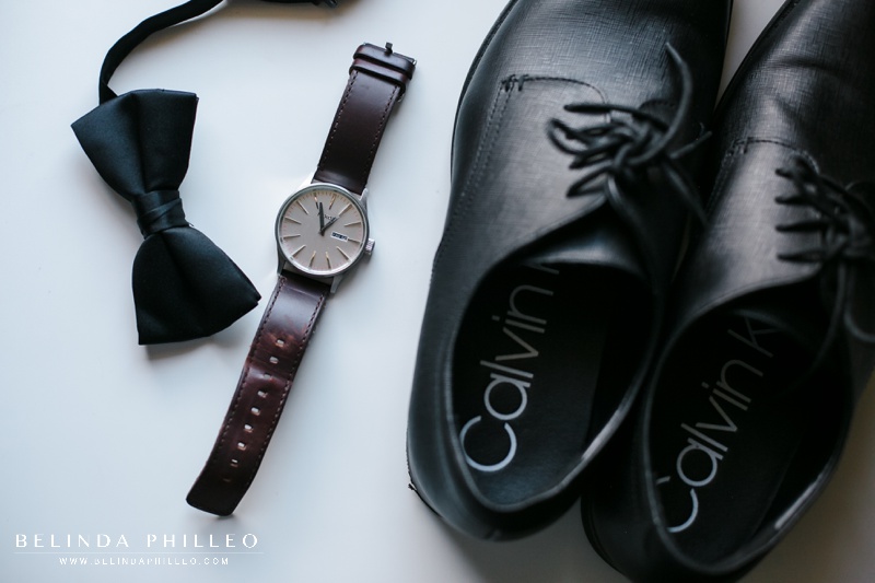 Calvin Klein dress shoes, watch, and black bow tie