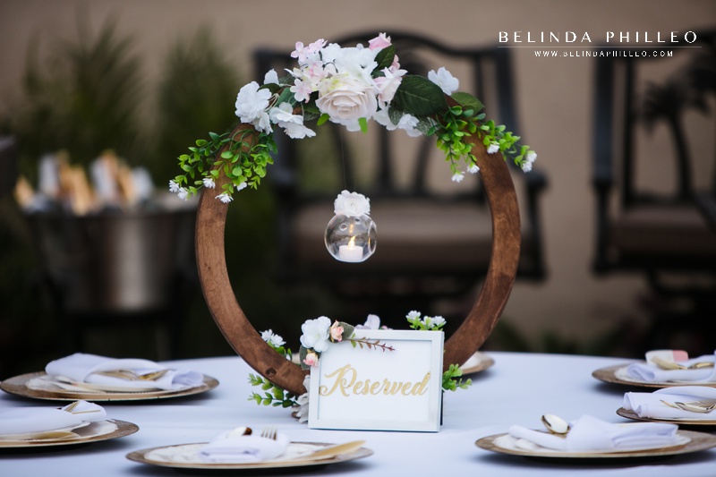 Wooden circle centerpiece with florals and candle holder