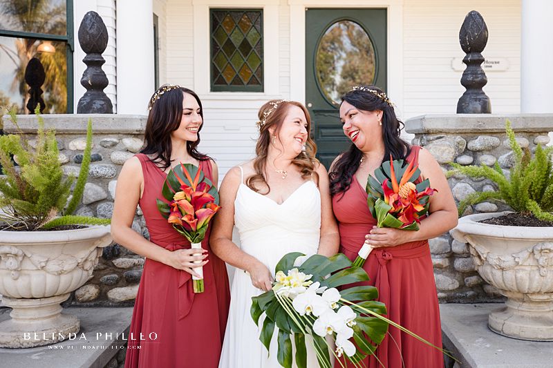 Bride and her bridesmaids show off tropical bouquets at Heritage Museum of Orange County Wedding in Santa Ana, CA. Photography by Belinda Philleo