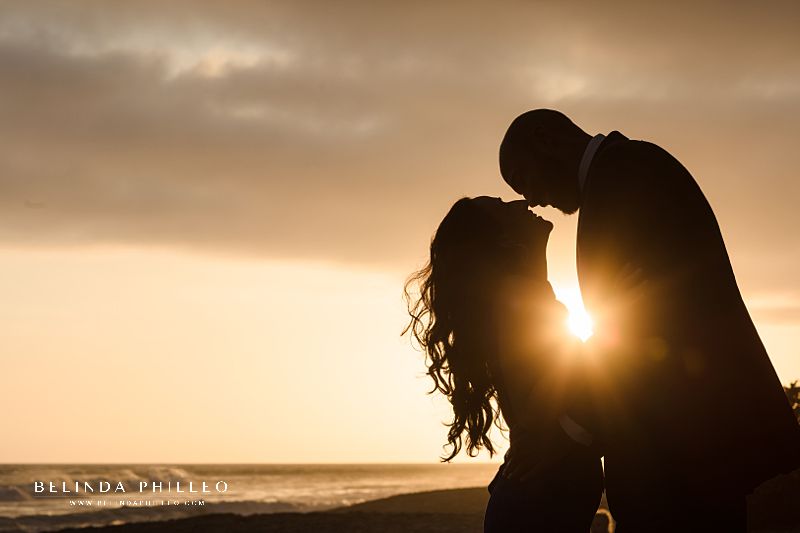 Couple shares a romantic sunset during Crystal Cove engagement photos session