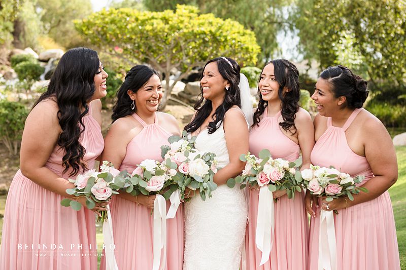 Blush bridesmaid gowns with halter style neck from David's Bridal