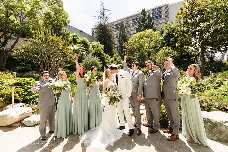 Bridal party cheers for newlyweds at JACCC garden wedding in Los Angeles, CA