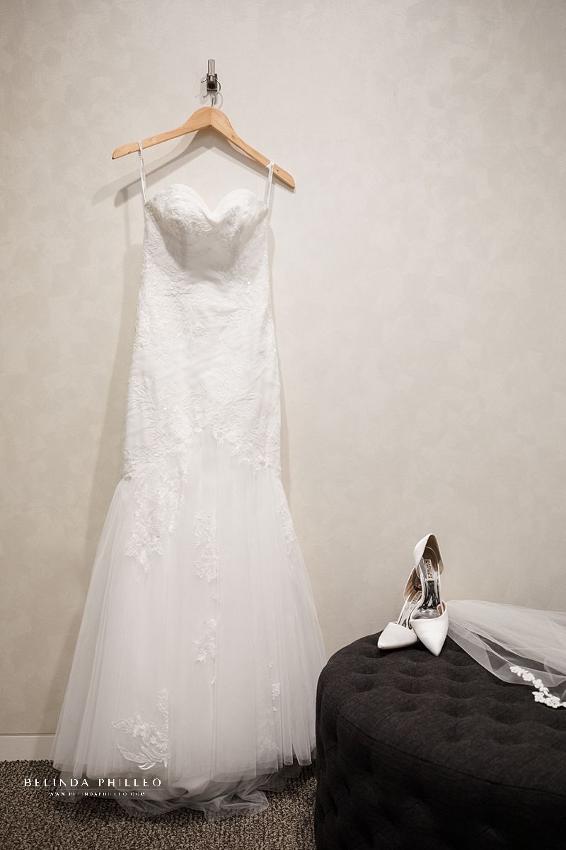 Oleg Cassini CWG926 bridal gown from David's Bridal and white Badgley Mischka heels