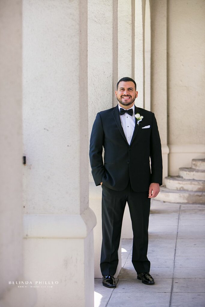 A man poses for a photo before his wedding in Los Angeles, CA. Belinda Philleo, a Southern California wedding photographer shares her best posing tips for men. 